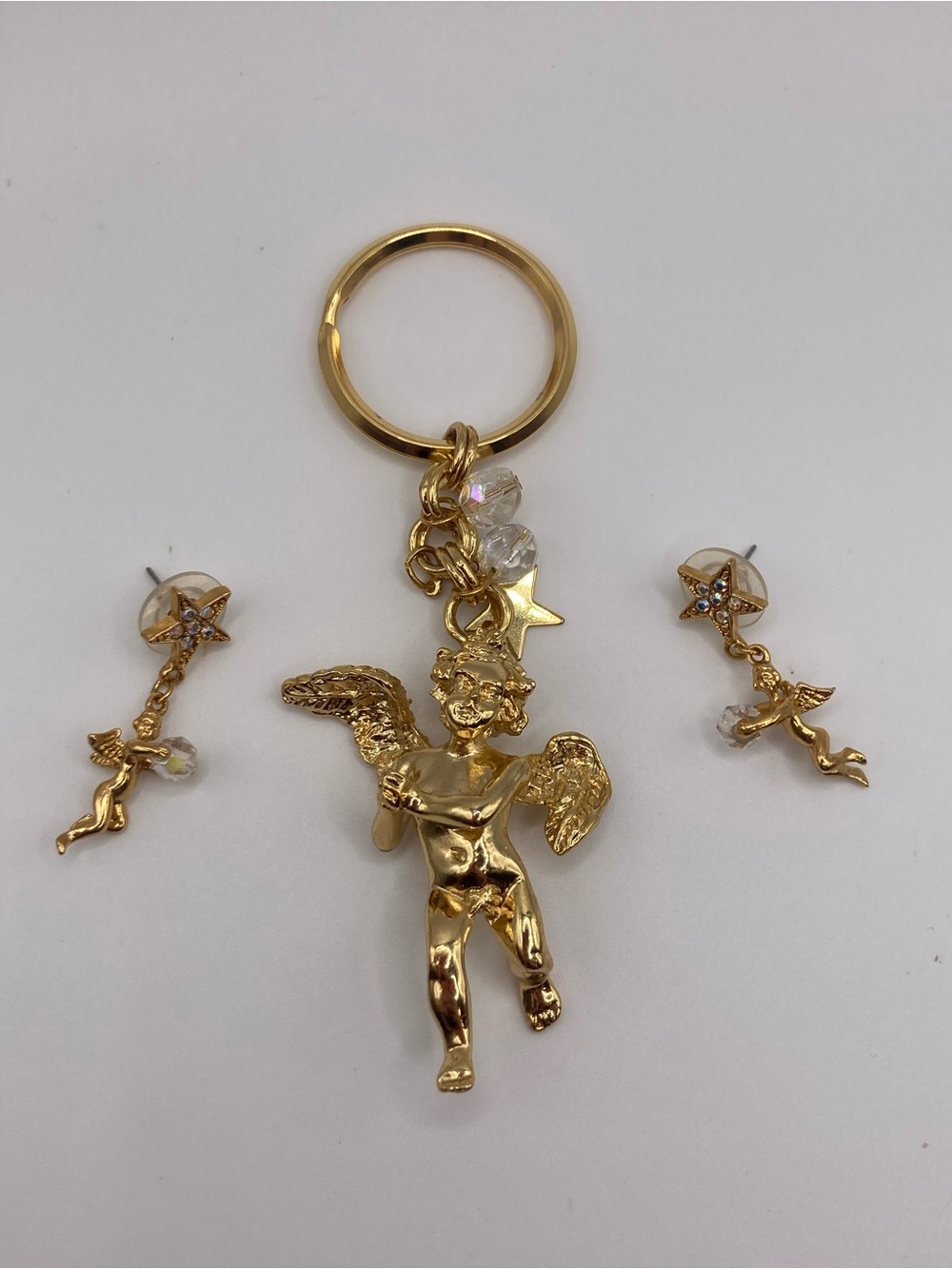 Kirks Folly gold-tone cherub keychain and matching earrings set